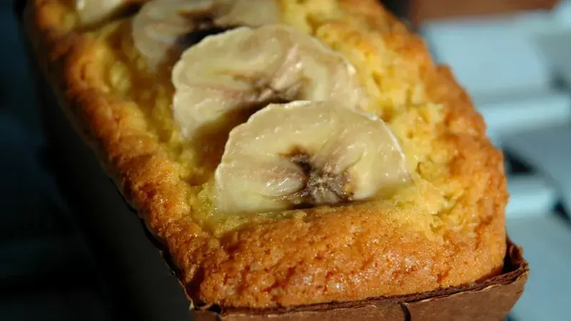 Banana bread loaf with slices on top