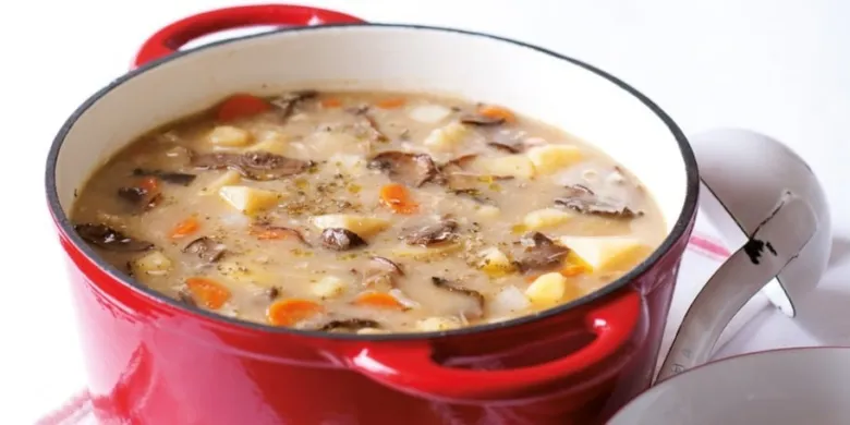 Mushroom and potato soup in pot