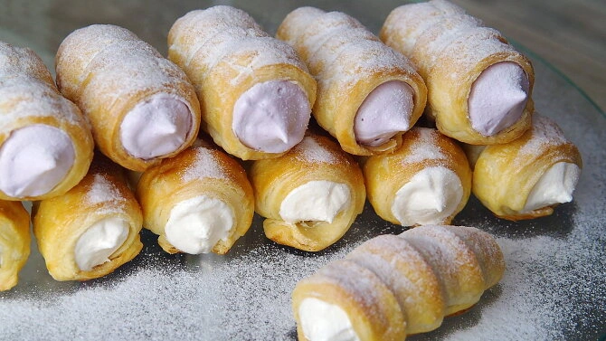 Filled cream rolls with powdered sugar