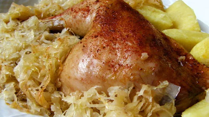 Roasted chicken with sauerkraut and potatoes