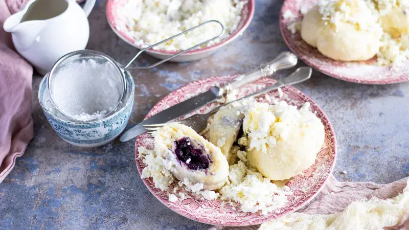 Steamed fruit dumplings with coconut topping