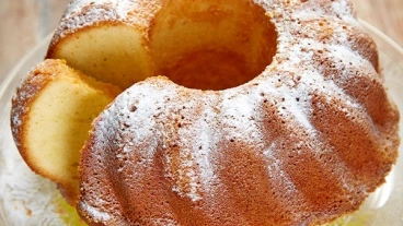 Baba cake with powdered sugar