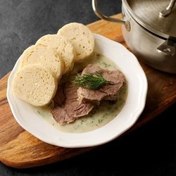 Hot Czech soup with tender beef slices and traditional knedlíky.