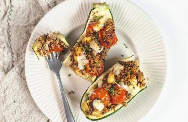 Stuffed zucchini boats with tomatoes and cheese