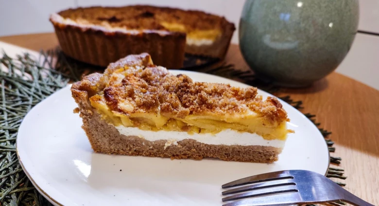 Slice of apple cheesecake tart