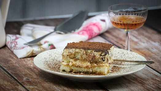 Slice of tiramisu with coffee liqueur